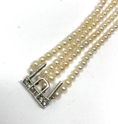 Lot 445 - PICKSLAY & CO: BELLE EPOQUE SEED PEARL AND DIAMOND BRACELET, 1900s