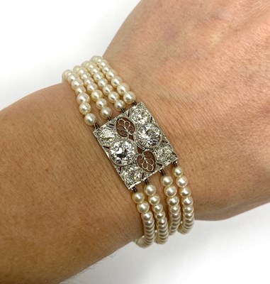 Lot 445 - PICKSLAY & CO: BELLE EPOQUE SEED PEARL AND DIAMOND BRACELET, 1900s