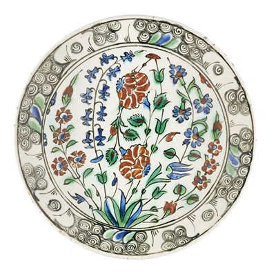 Lot 121 - AN IZNIK DISH, OTTOMAN ANATOLIA, CIRCA 1590