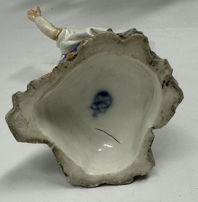 Lot 18 - TWO MEISSEN PORCELAIN FIGURES, CUPID IN DISGUISE AND A MAN SMOKING A PIPE, 18TH CENTURY