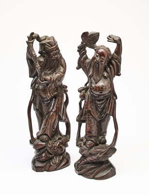 Lot 63 - A PAIR OF CHINESE SILVER-WIRE INLAID WOOD IMMORTALS, 20TH CENTURY