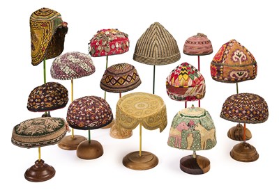 Lot 173 - A GROUP OF FOURTEEN EMBROIDERED CLOTH HATS, SOUTH AND CENTRAL ASIA, 19TH/20TH CENTURY