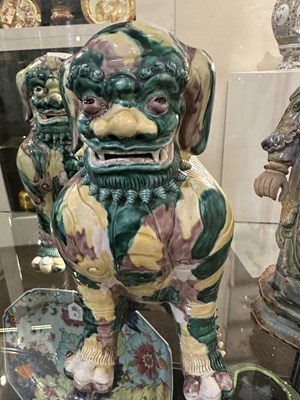 Lot 82 - A PAIR OF CHINESE FAMILLE-VERTE BUDDHIST LIONS, LATE QING DYNASTY, 19TH/20TH CENTURY