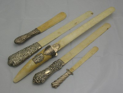 Lot 155 - FOUR VICTORIAN OR EDWARDIAN SILVER-MOUNTED IVORY LETTER OPENERS