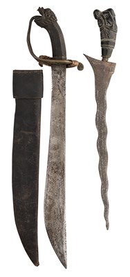 Lot 134 - A SOUTH EAST ASIAN SHORTSWORD AND A MALAYSIAN KRIS, 19TH CENTURY