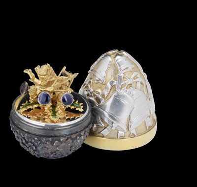 Lot 67 - A PARCEL-GILT AND OXIDISED SILVER 'SURPRISE' COMMEMORATIVE EGG