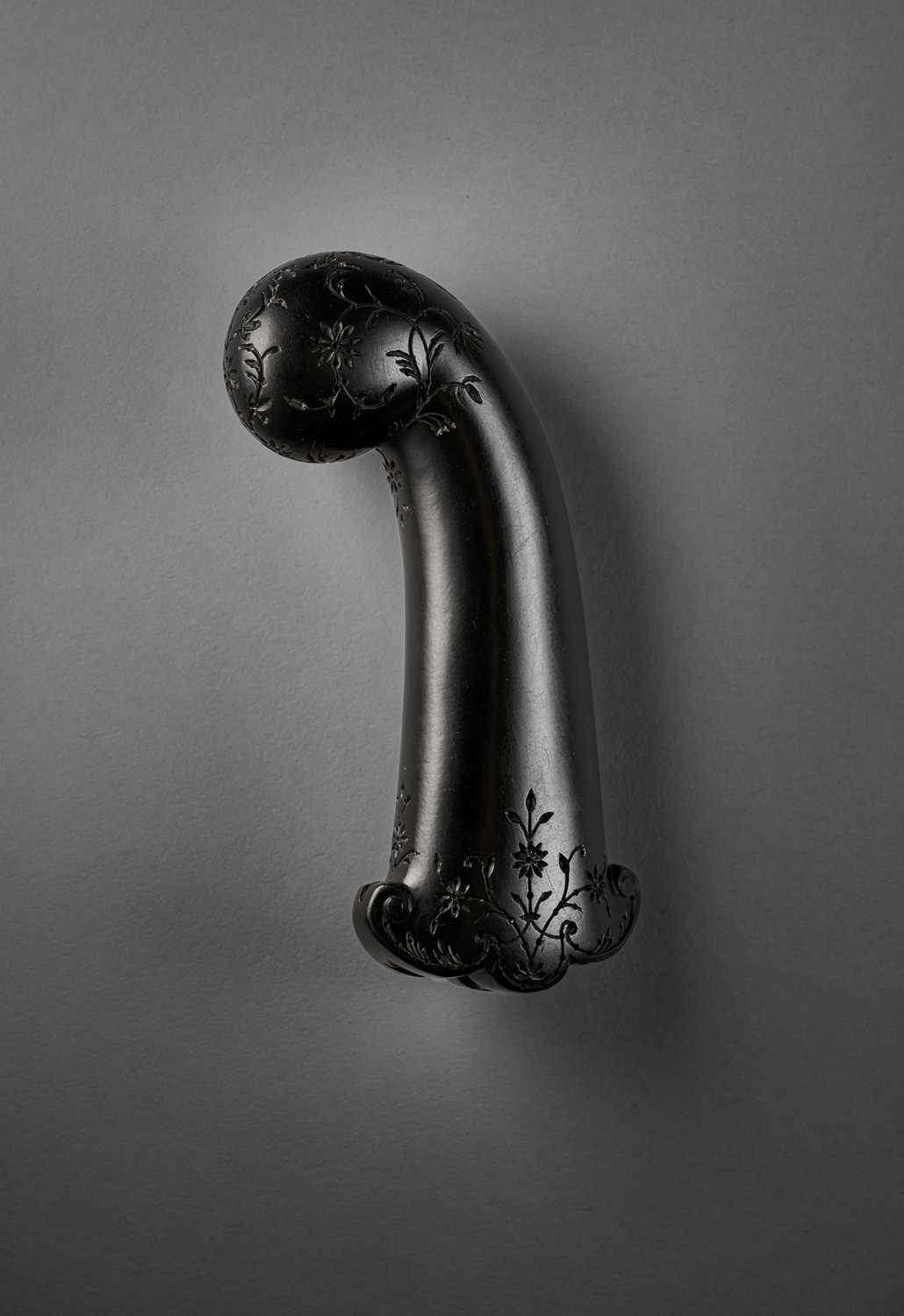 Lot 50 - A MUGHAL CARVED BLACK JADE DAGGER HILT, INDIA, 18TH CENTURY