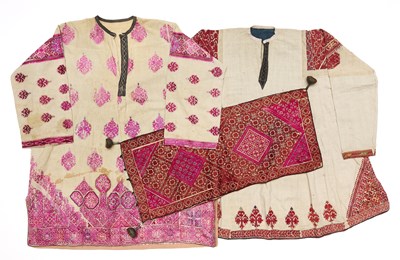Lot 70 - A PHULKARI SILK EMBROIDERED PILLOW COVER AND TWO SWAT DRESSES, PAKISTAN, EARLY 20TH CENTURY