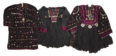 Lot 64 - THREE EMBROIDERED AND DECORATED WEDDING DRESSES (JUMLOS), AFGHANISTAN/NORTHWEST PAKISTAN, 1960-1980