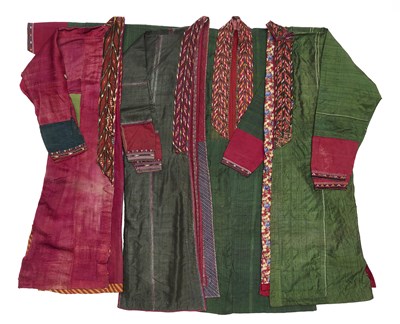 Lot 139 - A CRIMSON SILK VELVET TURKMAN ROBE (KURTE) AND THREE SILK KURTE, CENTRAL ASIA, LATE 19TH CENTURY