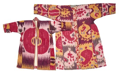 Lot 51 - A GIRL'S AND A CHILD'S IKAT CHAPAN, BOKHARA, UZBEKISTAN, EARLY 20TH CENTURY