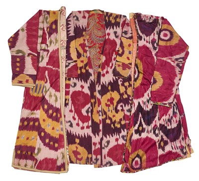 Lot 28 - THREE LADIES' IKAT ROBES (MUNISAK), BOKHARA, UZBEKISTAN, CIRCA 1900