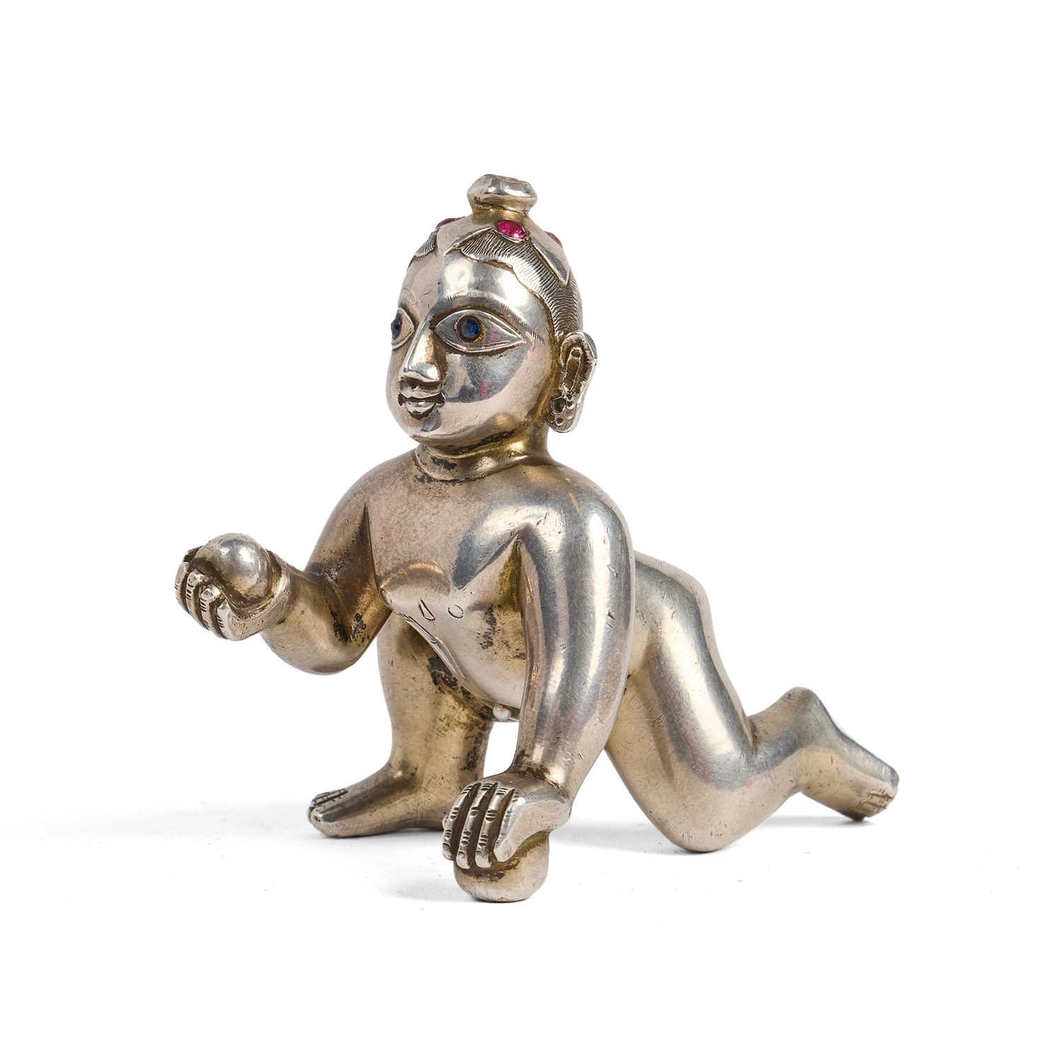 Lot 415 - A GEM-SET SILVER FIGURE OF BALAKRISHNA, BENGAL, 19TH/20TH CENTURY