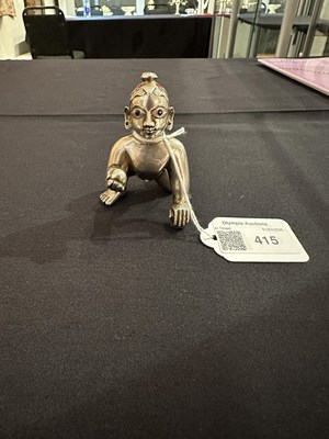 Lot 415 - A GEM-SET SILVER FIGURE OF BALAKRISHNA, BENGAL, 19TH/20TH CENTURY