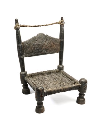 Lot 120 - A CARVED AND TURNED WOOD LOW CHAIR, SWAT VALLEY, PAKISTAN, 19TH CENTURY