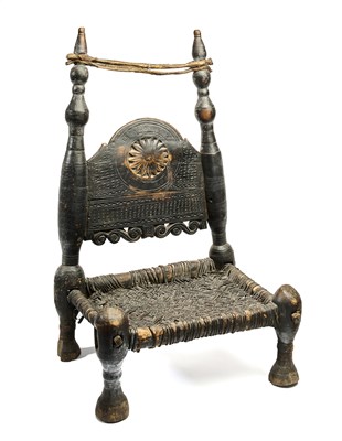 Lot 122 - A CARVED AND TURNED WOOD LOW CHAIR, SWAT VALLEY, PAKISTAN, 19TH CENTURY