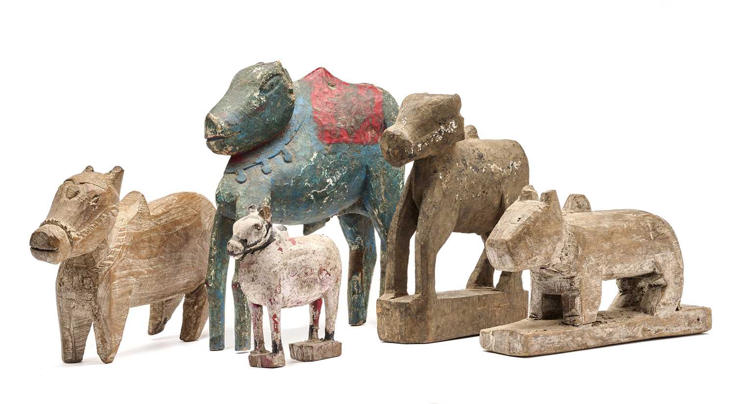Lot 75 - FIVE CARVED WOOD FIGURES OF NANDI BULL, INDIA,