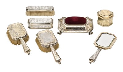 Lot 114 - A GEORGE V SILVER-GILT TOILET SET