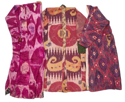 Lot 135 - AN IKAT PARANJA, A CHAPAN AND A MUNISAK, UZBEKISTAN, CIRCA 1900
