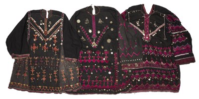 Lot 66 - THREE EMBROIDERED KOHISTAN DRESSES, PAKISTAN, MID 20TH CENTURY