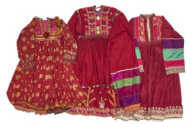 Lot 60 - A KUTCHI DRESS AND TWO SIMILAR DRESSES, AFGHANISTAN, 20TH CENTURY