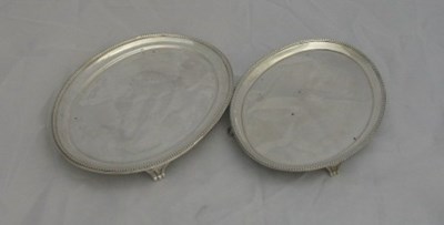 Lot 124 - TWO GEORGE III SILVER TEAPOT STANDS