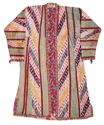 Lot 126 - A QUILTED IKAT BOY'S CHAPAN, BOKHARA, UZBEKISTAN, CIRCA 1900
