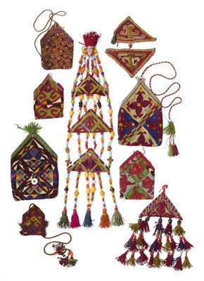Lot 165 - THREE EMBROIDERED AMULETS AND SIX EMBROIDERED POUCHES (BUKCHA), CENTRAL ASIA, CIRCA 1900