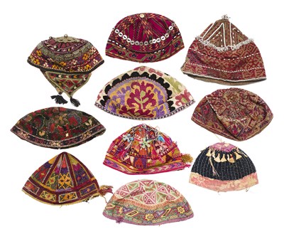 Lot 173 - A COLLECTION OF TEN EMBROIDERED AND EMBELLISHED HATS, CENTRAL ASIA AND AFGHANISTAN, 20TH CENTURY