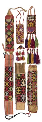Lot 172 - SIX LAKAI EMBROIDERED BANDS AND AN AMULET, UZBEKISTAN, LATE 19TH/EARLY 20TH CENTURY