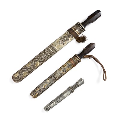 Lot 98 - THREE BHUTANESE OR TIBETAN DAGGERS, 19TH CENTURY