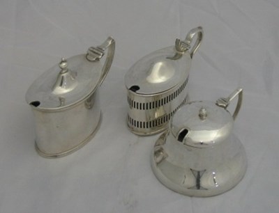 Lot 150 - THREE SILVER MUSTARD POTS