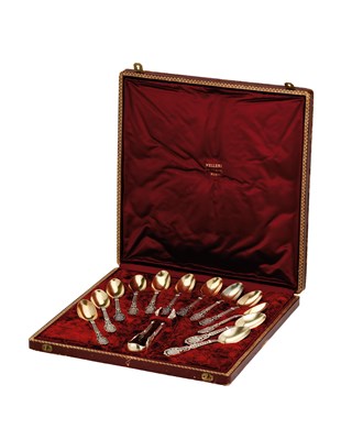 Lot 171 - A CASED SET OF TWELVE FRENCH PARCEL-GILT-SILVER TEASPOONS AND A PAIR OF SUGAR TONGS