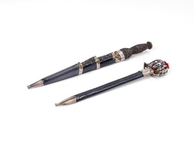 Lot 162 - A LETTER OPENER IN THE FORM OF A SCOTTISH BASKET-HILTED BROADSWORD, AND A MINIATURE DIRK OF THE