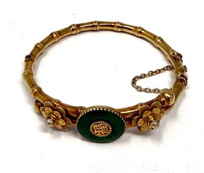 Lot 388 - GOLD, JADEITE AND SEED PEARL HINGED BANGLE, 1900s