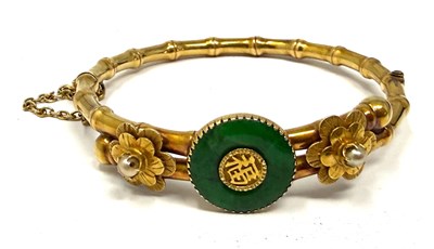 Lot 388 - GOLD, JADEITE AND SEED PEARL HINGED BANGLE, 1900s