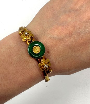 Lot 388 - GOLD, JADEITE AND SEED PEARL HINGED BANGLE, 1900s