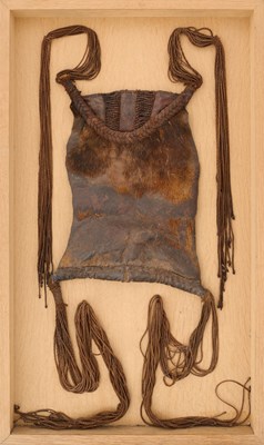 Lot 136 - AN AFRICAN (TUAREG) LEATHER BAG, AND A NAGA DAO HOLDER AND BELT, BOTH LATE 19TH/EARLY 20TH CENTURY