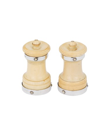 Lot 219 - A PAIR OF VICTORIAN SILVER-MOUNTED IVORY PEPPER GRINDERS