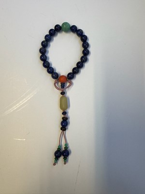 Lot 25 - A CHINESE LAPIS LAZULI PRAYER BRACELET, QING DYNASTY (1644-1911)