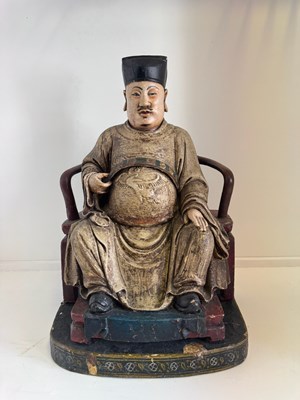 Lot 29 - A CHINESE CARVED WOOD AND GESSO FIGURE OF A SEATED DIGNITARY, QING DYNASTY