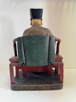 Lot 29 - A CHINESE CARVED WOOD AND GESSO FIGURE OF A SEATED DIGNITARY, QING DYNASTY