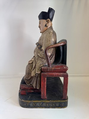 Lot 29 - A CHINESE CARVED WOOD AND GESSO FIGURE OF A SEATED DIGNITARY, QING DYNASTY