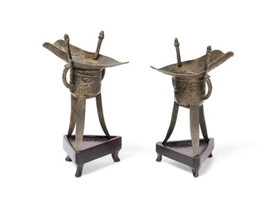 Lot 57 - A PAIR OF CHINESE ARCHAISTIC WHITE METAL LIBATION CUPS, JUE, QING DYNASTY, 19TH CENTURY