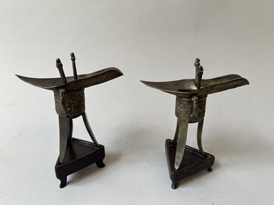 Lot 57 - A PAIR OF CHINESE ARCHAISTIC WHITE METAL LIBATION CUPS, JUE, QING DYNASTY, 19TH CENTURY