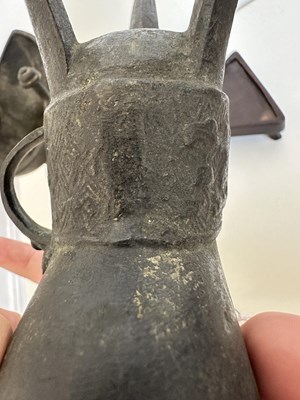 Lot 59 - A PAIR OF ARCHAISTIC BRONZE LIBATION CUPS, JUE, MING DYNASTY