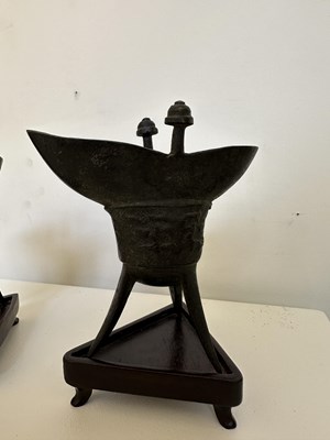 Lot 59 - A PAIR OF ARCHAISTIC BRONZE LIBATION CUPS, JUE, MING DYNASTY