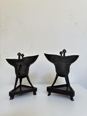Lot 59 - A PAIR OF ARCHAISTIC BRONZE LIBATION CUPS, JUE, MING DYNASTY