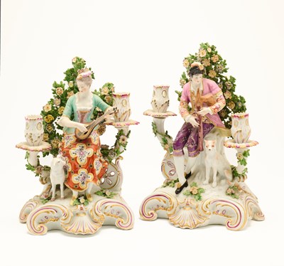 Lot 24 - A PAIR OF CONTINENTAL PORCELAIN FIGURAL CANDELABRA, PROBABLY SAMSON, LATE 19TH CENTURY