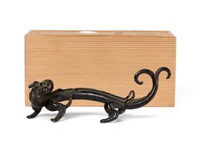 Lot 54 - A CHINESE BRONZE 'CHILONG' BRUSHREST, 17TH CENTURY